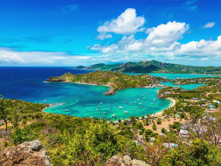 Beautiful bright and colorful aerial view of English harbor, Shirley Heights in Antigua, Caribbean. Landscape with blue sky and white clouds.
