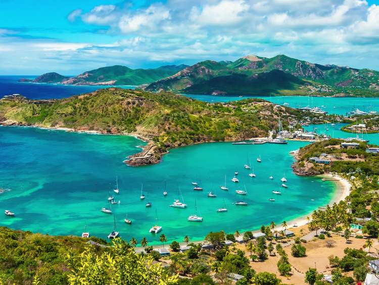 Beautiful bright and colorful aerial view of English harbor, Shirley Heights in Antigua, Caribbean. Landscape with blue sky and white clouds.