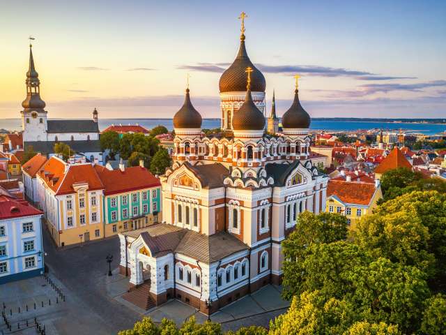 aerial view of Alexander Nevsky cathedral and St Mary's Cathedral at sunset in Tallinn, Estonia