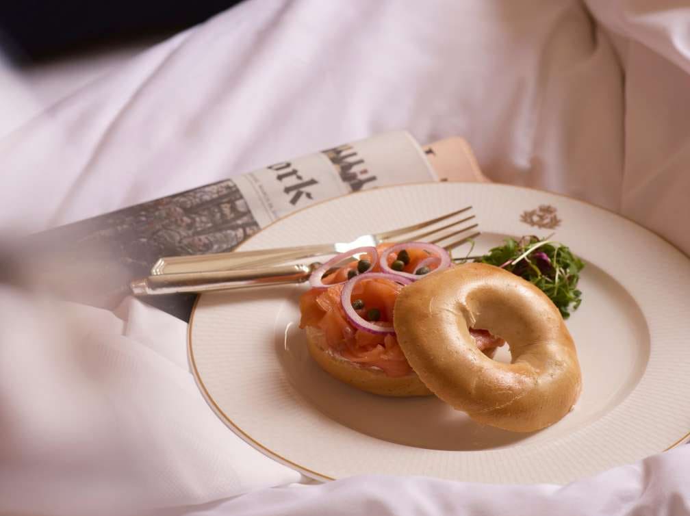 Breakfast in bed and a newspaper in a Cunard stateroom