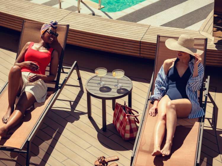 Guests relax beside Queen Anne's Panorama Pool