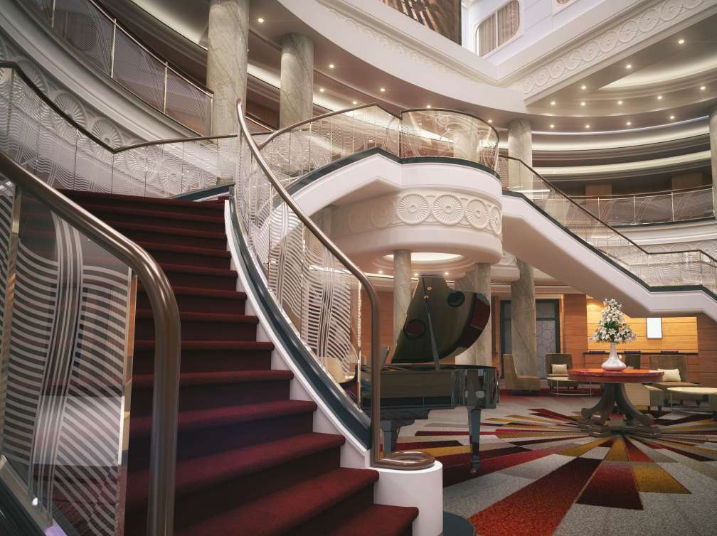 Queen mary 2's Grand Lobby with sweeping staircase, purser's desk, and shops above