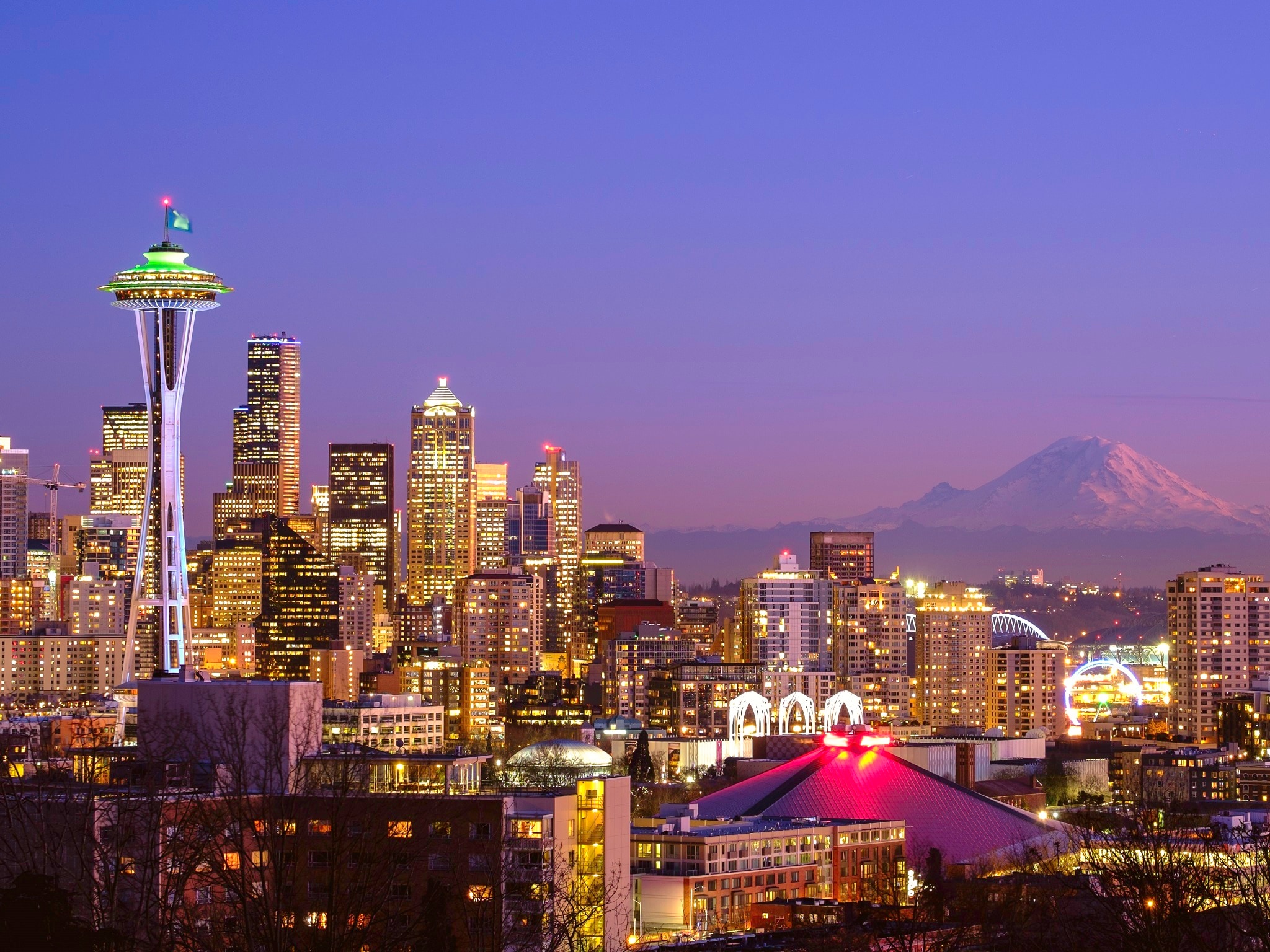 A scenic view of the Space Needle in Seattle, WA and the Mt. Rainier is visible in the background. This picture taken from Kerry Park, Queen Anne area on January 29, 2015 at 17:50.