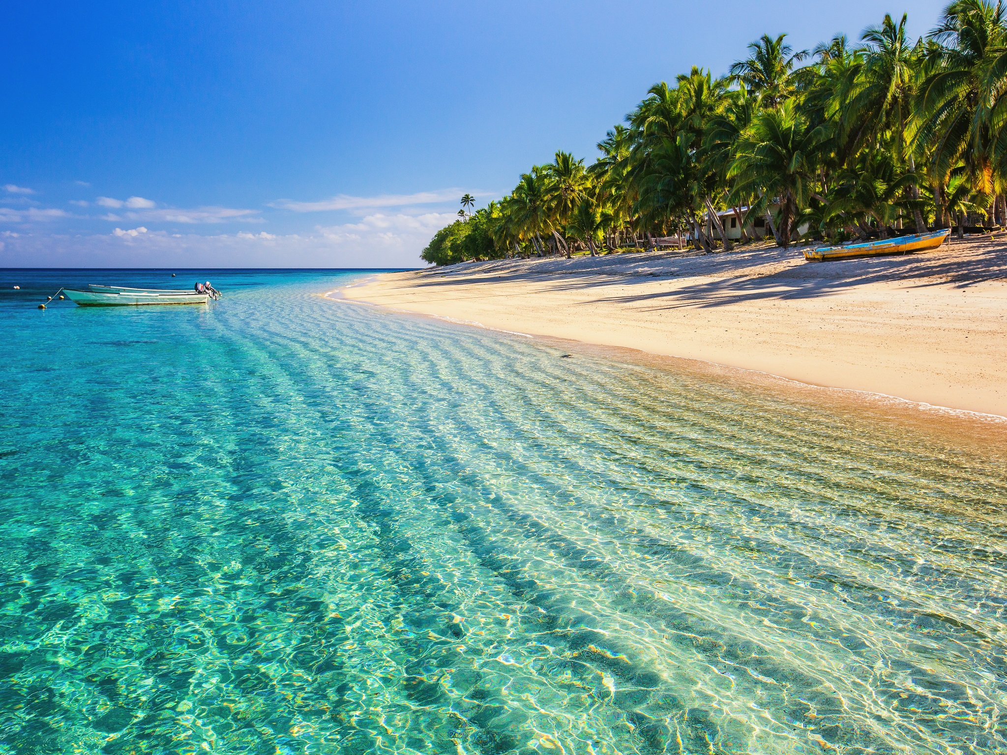 Dravuni Island, Fiji. Beach on the tropical islandand clear turquoise water.