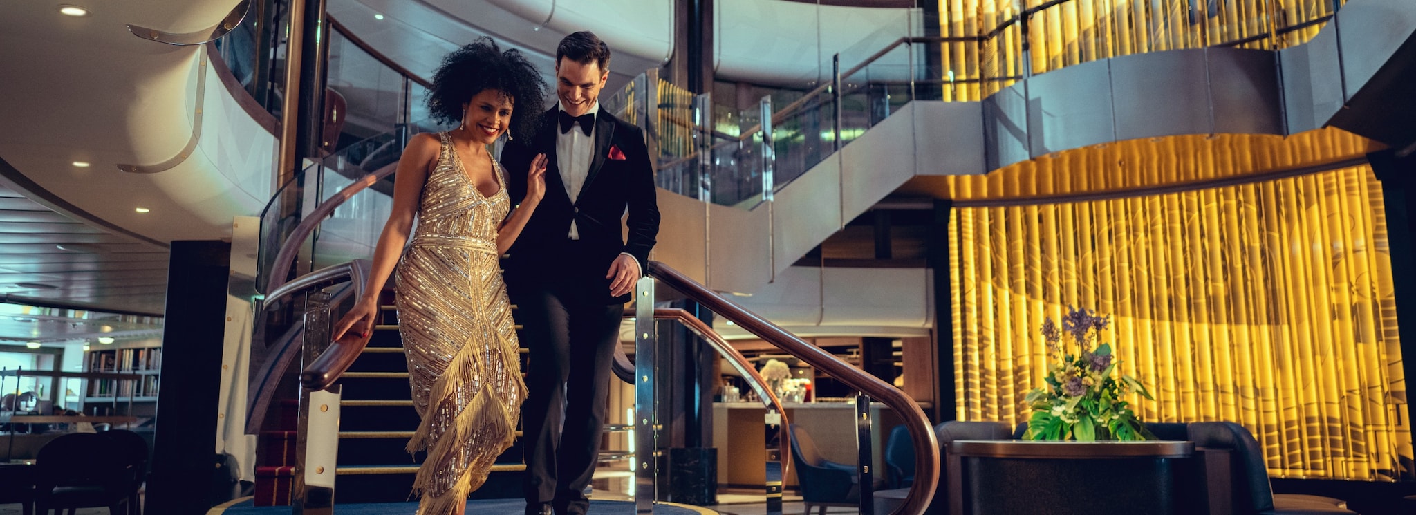 {"metadata_en_GB":{"alt-text":"A man and a woman in eveningwear descend the staircase in the Grand Lobby on a Queen Anne Gala Evening"},"metadata_en_AU":{"alt-text":"A man and a woman in eveningwear descend the staircase in the Grand Lobby on a Queen Anne Gala Evening"},"metadata_en_US":{"alt-text":"A man and a woman in eveningwear descend the staircase in the Grand Lobby on a Queen Anne Gala Evening"}}