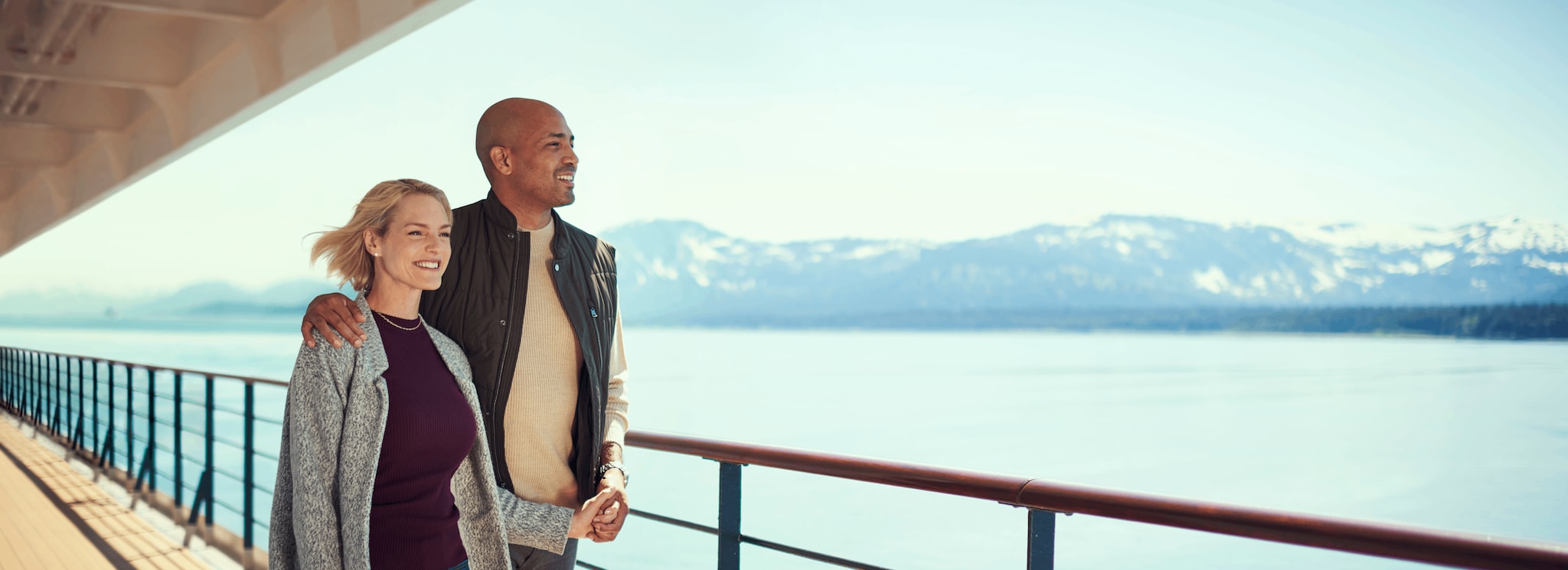 {"metadata_en_GB":{"alt-text":"Couple enjoying scenic ocean views from the deck of a luxury cruise ship with snow-capped mountains in the distance"},"metadata_de_DE":{"alt-text":"Paar genießt die Aussicht auf das Meer vom Deck eines Luxuskreuzfahrtschiffs mit schneebedeckten Bergen im Hintergrund"},"metadata_en_AU":{"alt-text":"Couple enjoying scenic ocean views from the deck of a luxury cruise ship with snow-capped mountains in the distance"},"metadata_en_US":{"alt-text":"Couple enjoying scenic ocean views from the deck of a luxury cruise ship with snow-capped mountains in the distance"}}