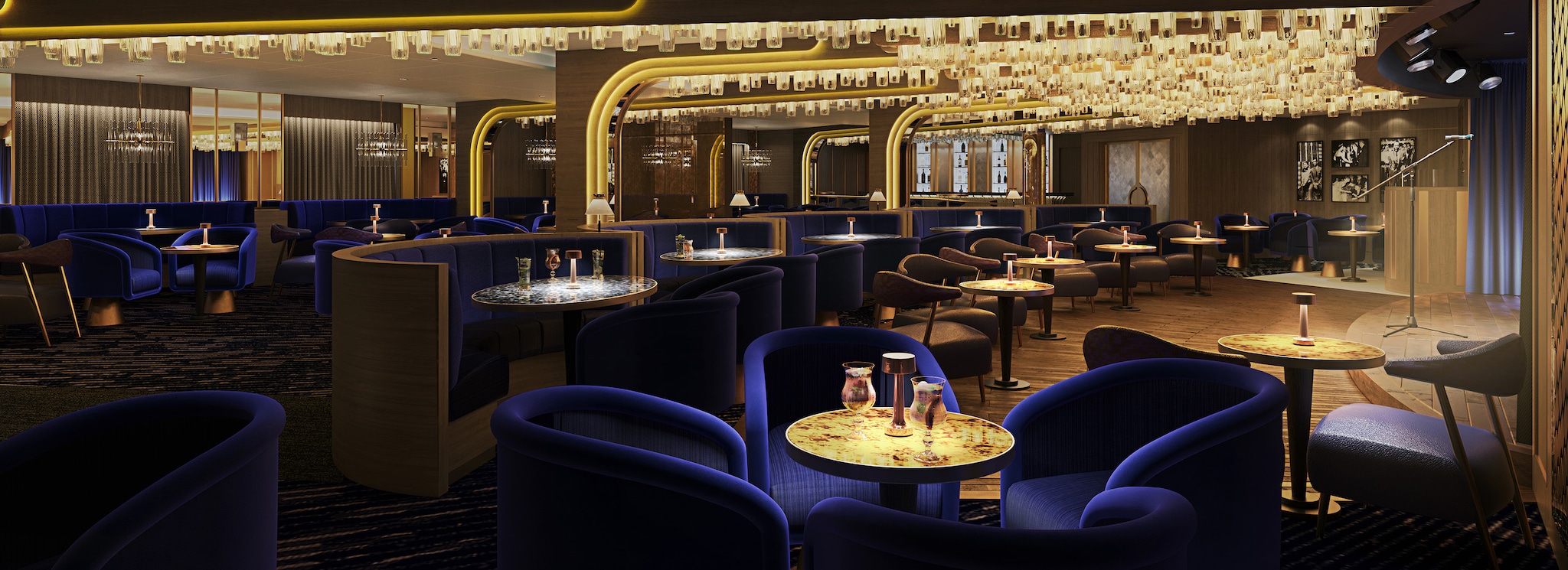 {"metadata_en_GB":{"alt-text":"Bright Lights Society show bar on Queen Anne, with golden lights, a low stage and comfortable royal blue seating"},"metadata_en_AU":{"alt-text":"Bright Lights Society show bar on Queen Anne, with golden lights, a low stage and comfortable royal blue seating"},"metadata_en_US":{"alt-text":"Bright Lights Society show bar on Queen Anne, with golden lights, a low stage and comfortable royal blue seating"}}