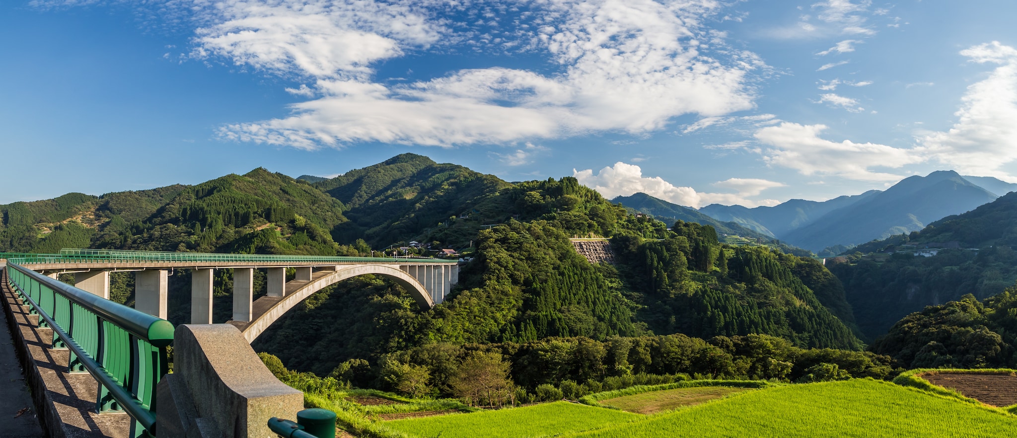rice field landscape and arch bridge in Takachiho, Miyazaki, Japan; Shutterstock ID 582795865
