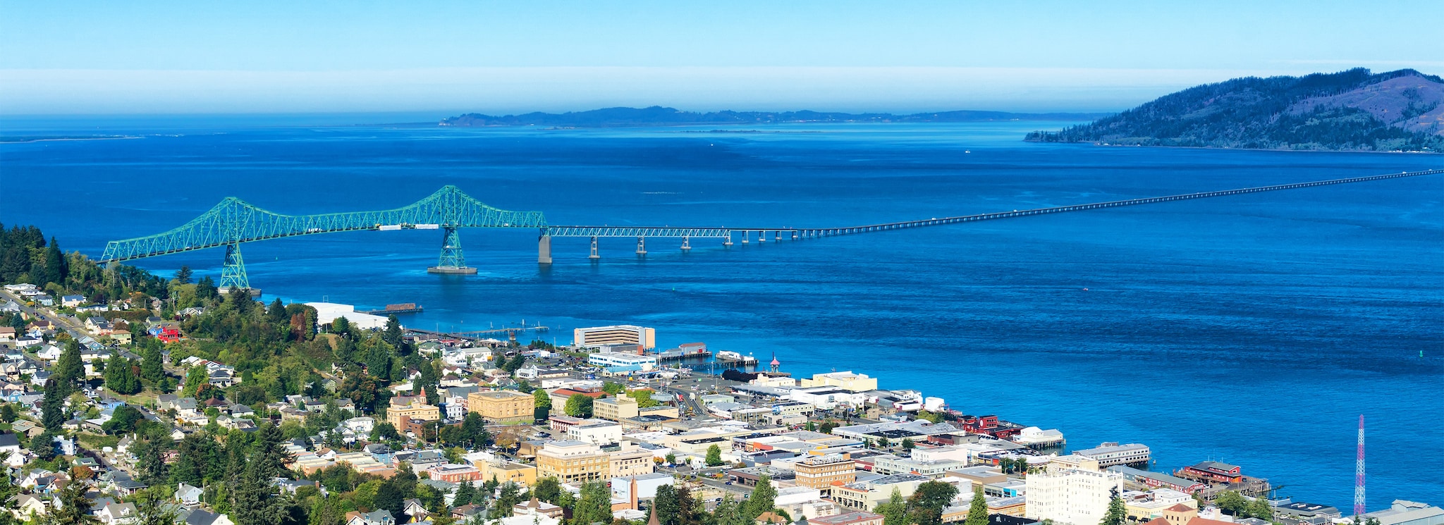 Astoria, Oregon, the first permanent U.S. settlement on the Pacific coast, overlooks the Astoria Megler bridge as it crosses the Columbia river to the state of Washington.; Shutterstock ID 530713759; Purchase Order: -