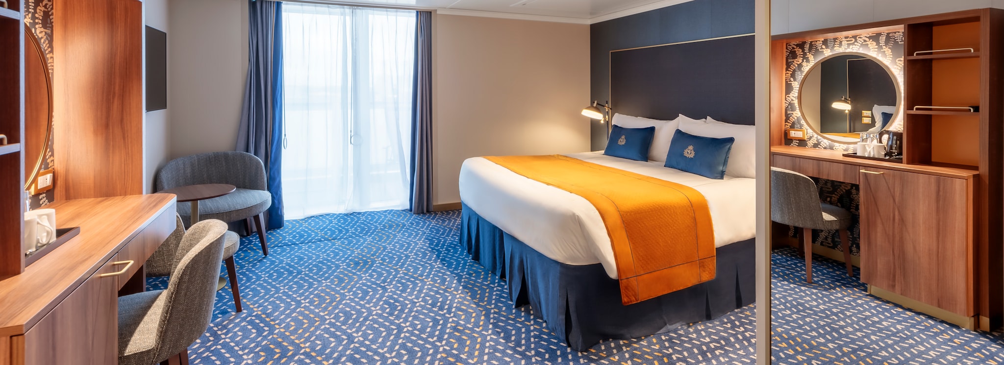 {"metadata_en_GB":{"alt-text":"A Queen Anne Britannia Balcony stateroom, showing kingsize bed, wall-mounted television, desk and balcony access"},"metadata_en_AU":{"alt-text":"A Queen Anne Britannia Balcony stateroom, showing kingsize bed, wall-mounted television, desk and balcony access"},"metadata_en_US":{"alt-text":"A Queen Anne Britannia Balcony stateroom, showing kingsize bed, wall-mounted television, desk and balcony access"}}