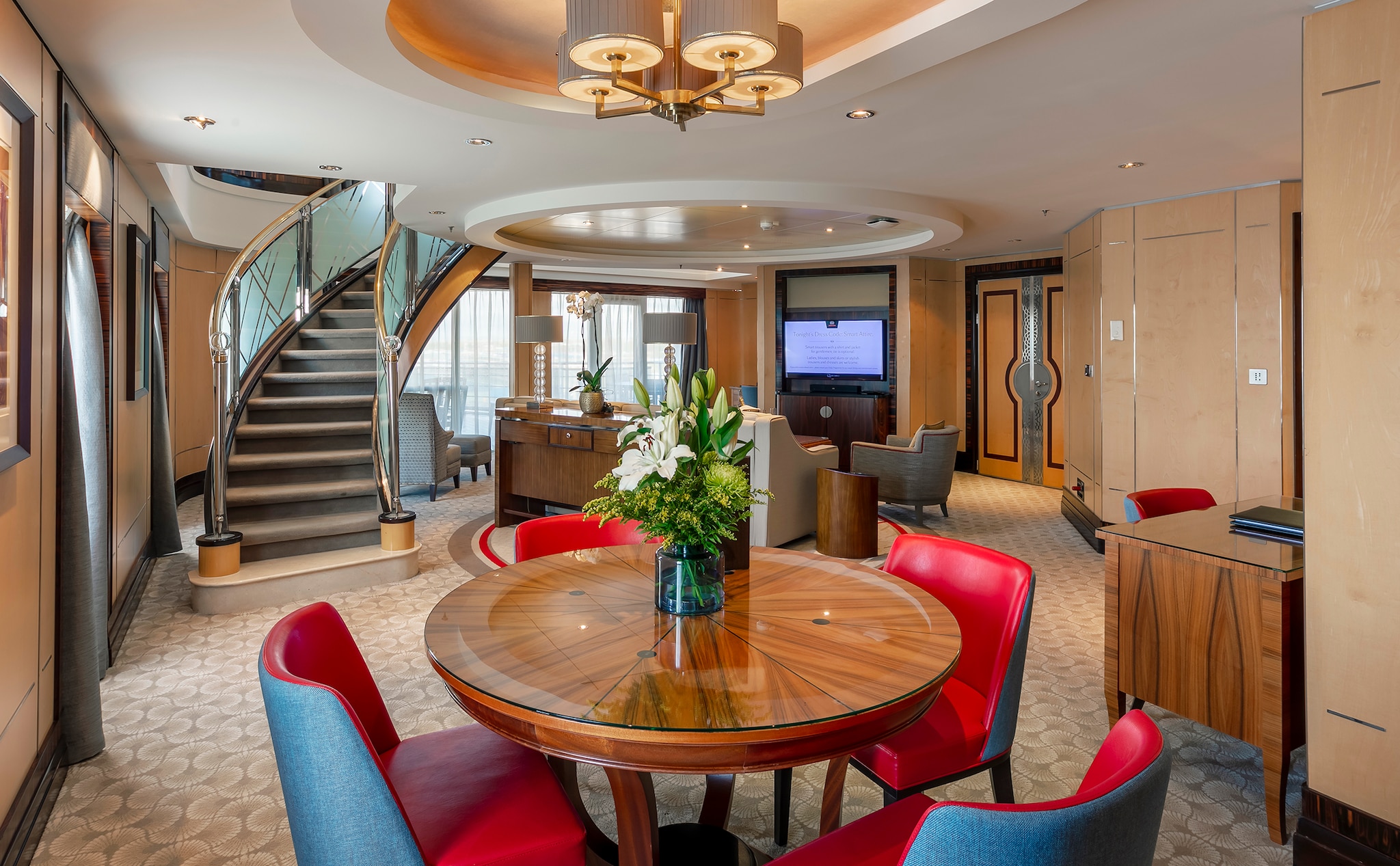 {"metadata_en_GB":{"alt-text":"Lower floor living area of a Q1 Grand Duplex Queens Grill Suite on Queen Mary 2, showing dining area, staircase, sofa and wall-mounted television"},"metadata_en_AU":{"alt-text":"Lower floor living area of a Q1 Grand Duplex Queens Grill Suite on Queen Mary 2, showing dining area, staircase, sofa and wall-mounted television"},"metadata_en_US":{"alt-text":"Lower floor living area of a Q1 Grand Duplex Queens Grill Suite on Queen Mary 2, showing dining area, staircase, sofa and wall-mounted television"}}