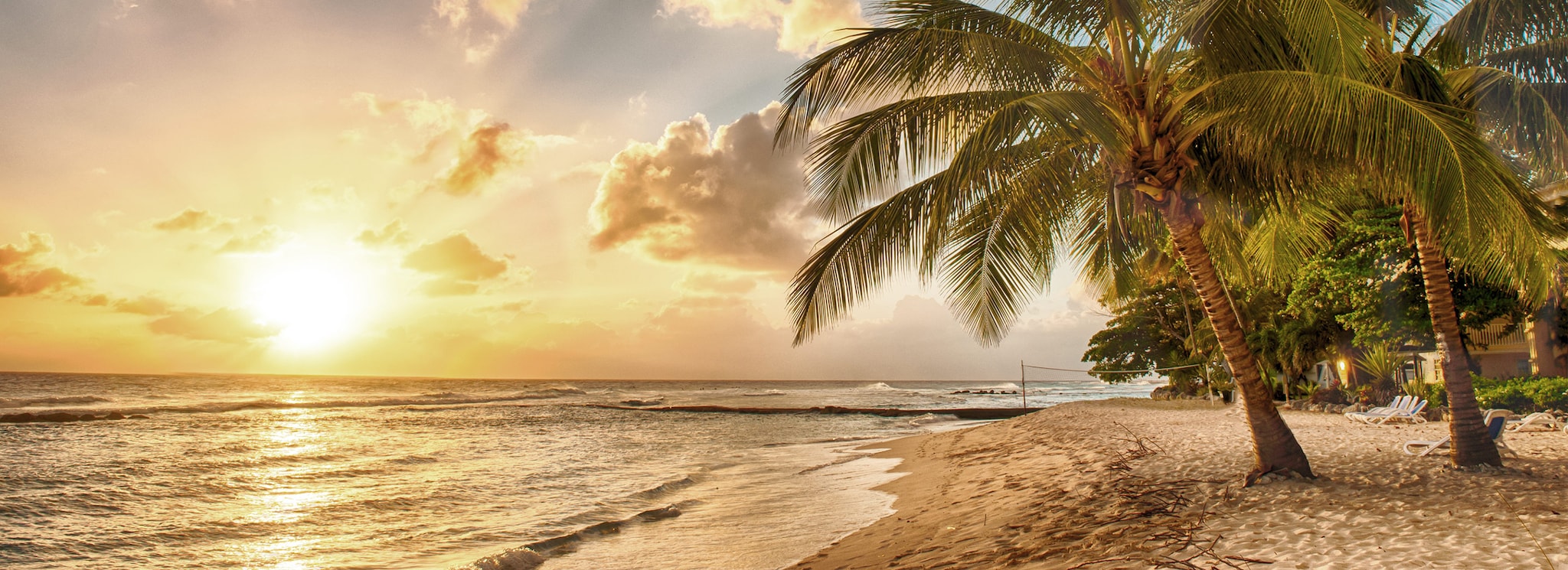 {"metadata_en_GB":{"alt-text":"Sunset beach of Barbados with clouds in the sky, a large palm tree in the foreground on a sandy beach"},"metadata_en_AU":{"alt-text":"Sunset beach of Barbados with clouds in the sky, a large palm tree in the foreground on a sandy beach"},"metadata_en_US":{"alt-text":"Sunset beach of Barbados with clouds in the sky, a large palm tree in the foreground on a sandy beach"}}