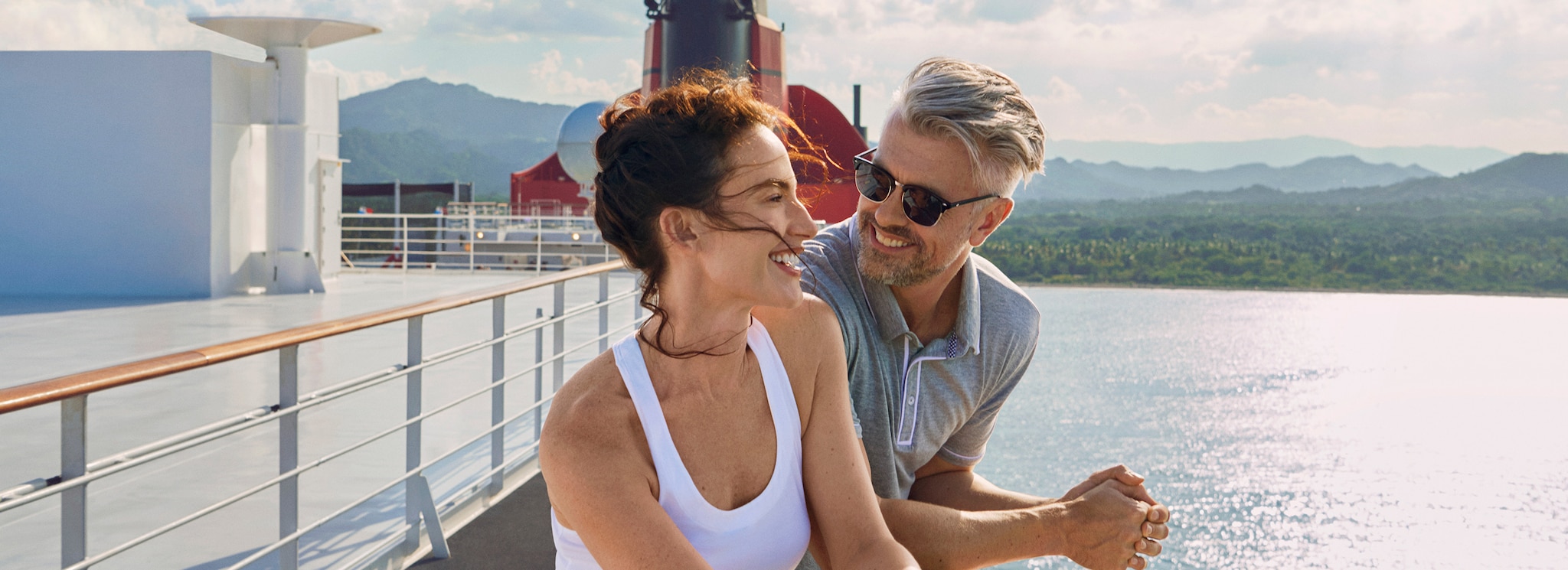 Brand shot of Man and Woman relaxing on deck