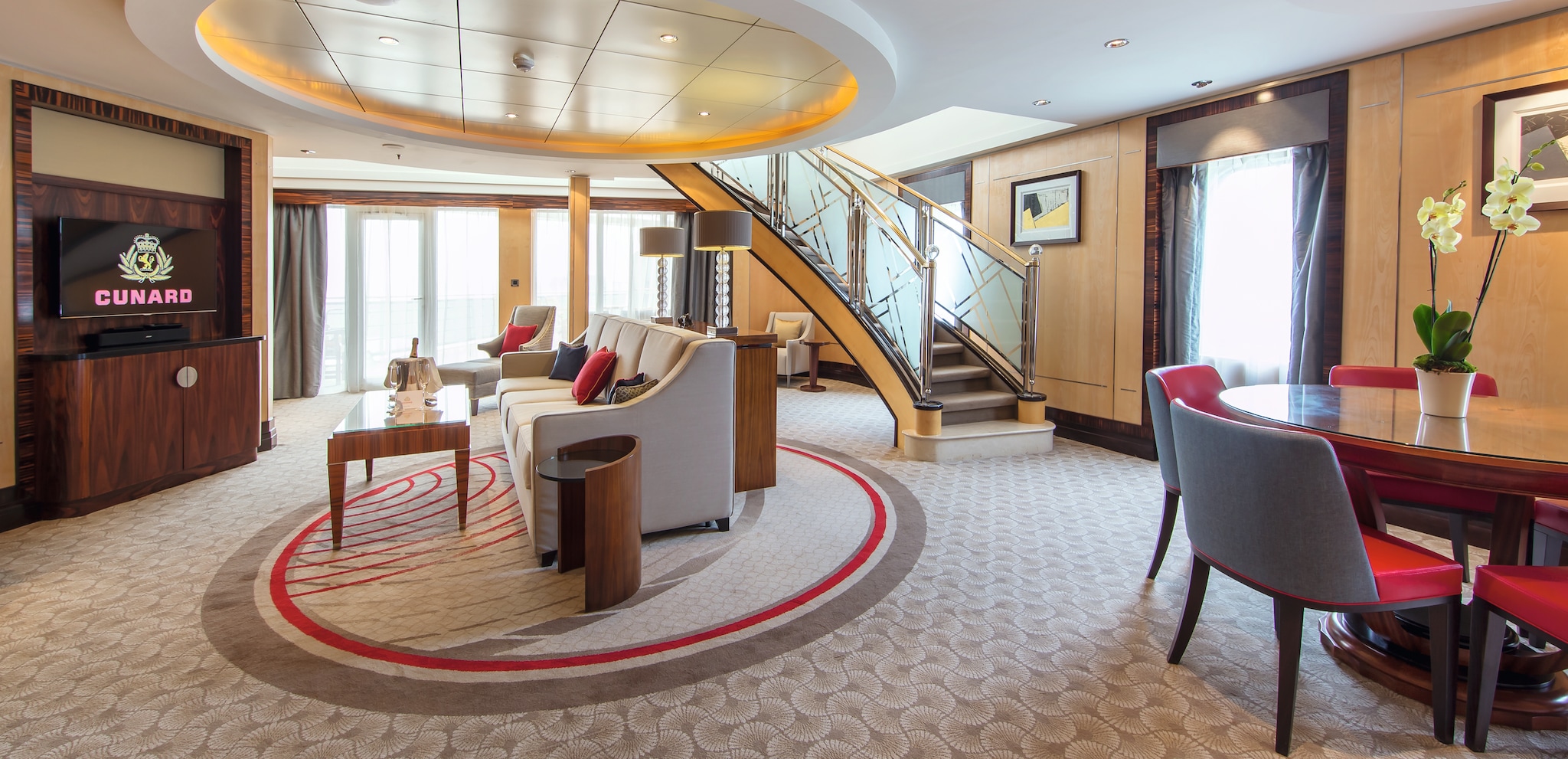 {"metadata_en_GB":{"alt-text":"The lower level of the Balmoral Suite on Cunard's flagship, QM2.  A spacious lounge area, with dining table, balcony doors and sweeping staircase, are the centre to one of our most luxurious suites on board."},"metadata_en_AU":{"alt-text":"The lower level of the Balmoral Suite on Cunard's flagship, QM2.  A spacious lounge area, with dining table, balcony doors and sweeping staircase, are the centre to one of our most luxurious suites on board."},"metadata_en_US":{"alt-text":"The lower level of the Balmoral Suite on Cunard's flagship, QM2.  A spacious lounge area, with dining table, balcony doors and sweeping staircase, are the centre to one of our most luxurious suites on board."}}
